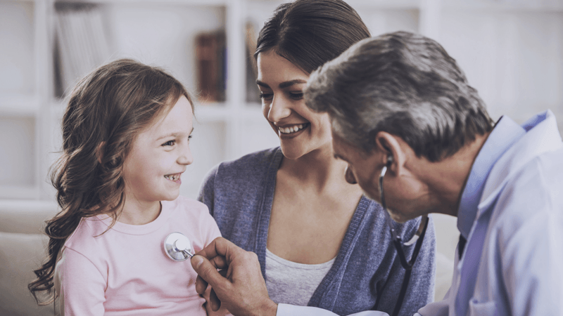 Medical doctor caring for a child.