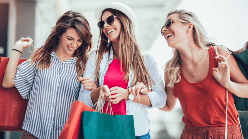 Three women shopping.