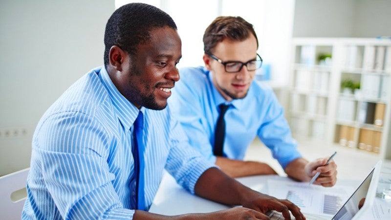 Two businessmen discussing local seo.
