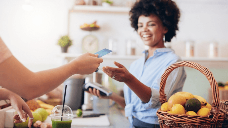 Customer making a credit card purchase in a shop.