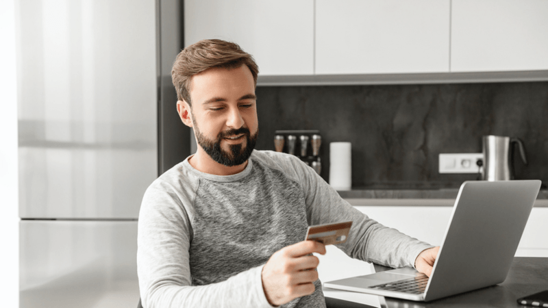 Man making a purchase online with a credit card.