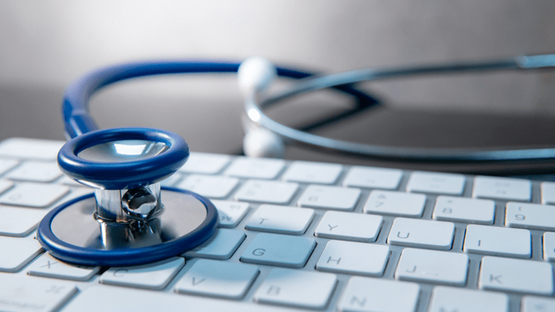 Computer keyboard and stethoscope.