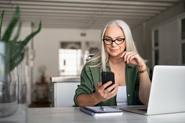 Customer looking at her phone. Customer looking at her phone.