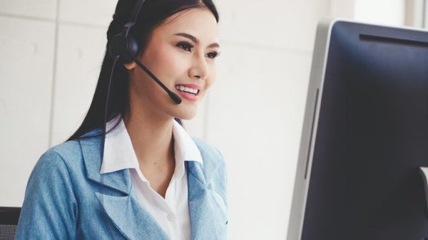Woman wearing a headset. Woman wearing a headset.
