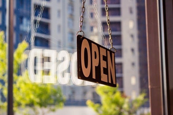 Open sign in a window. Open sign in a window.