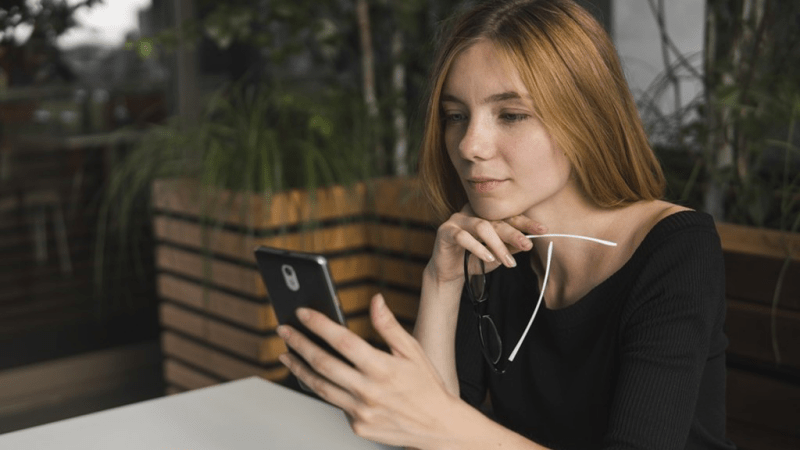 Woman using google my business on her phone.