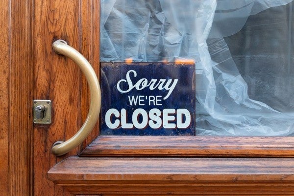 Business entry door with closed sign. Business entry door with closed sign.