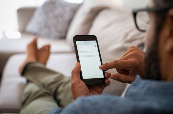 Man typing on his phone. Man typing on his phone.