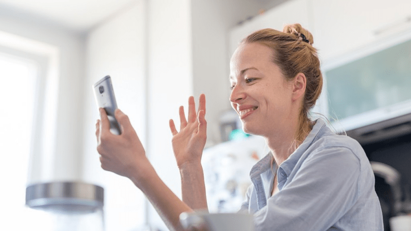 Woman checking her social media account using her phone.
