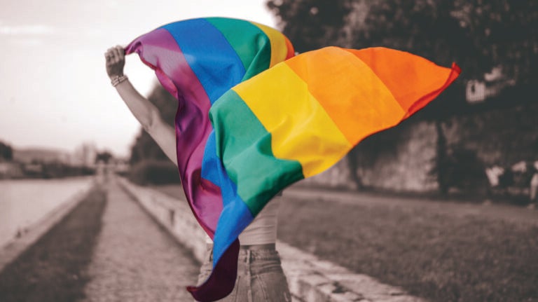 Woman with rainbow flag